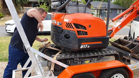 how to transport a mini excavator|mini excavator tie down requirements.